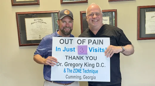 Chiropractor Cumming GA Gregory King With Patient